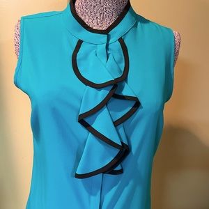 Calvin Klein sleeveless blouse looks great with a blazer or suit